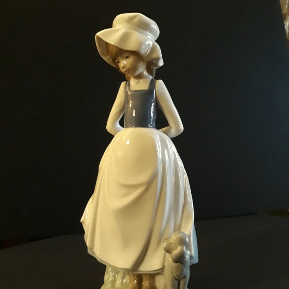 Nao by Lladro Girl and poodle figurine #0397 titled "Cheer Me Up"